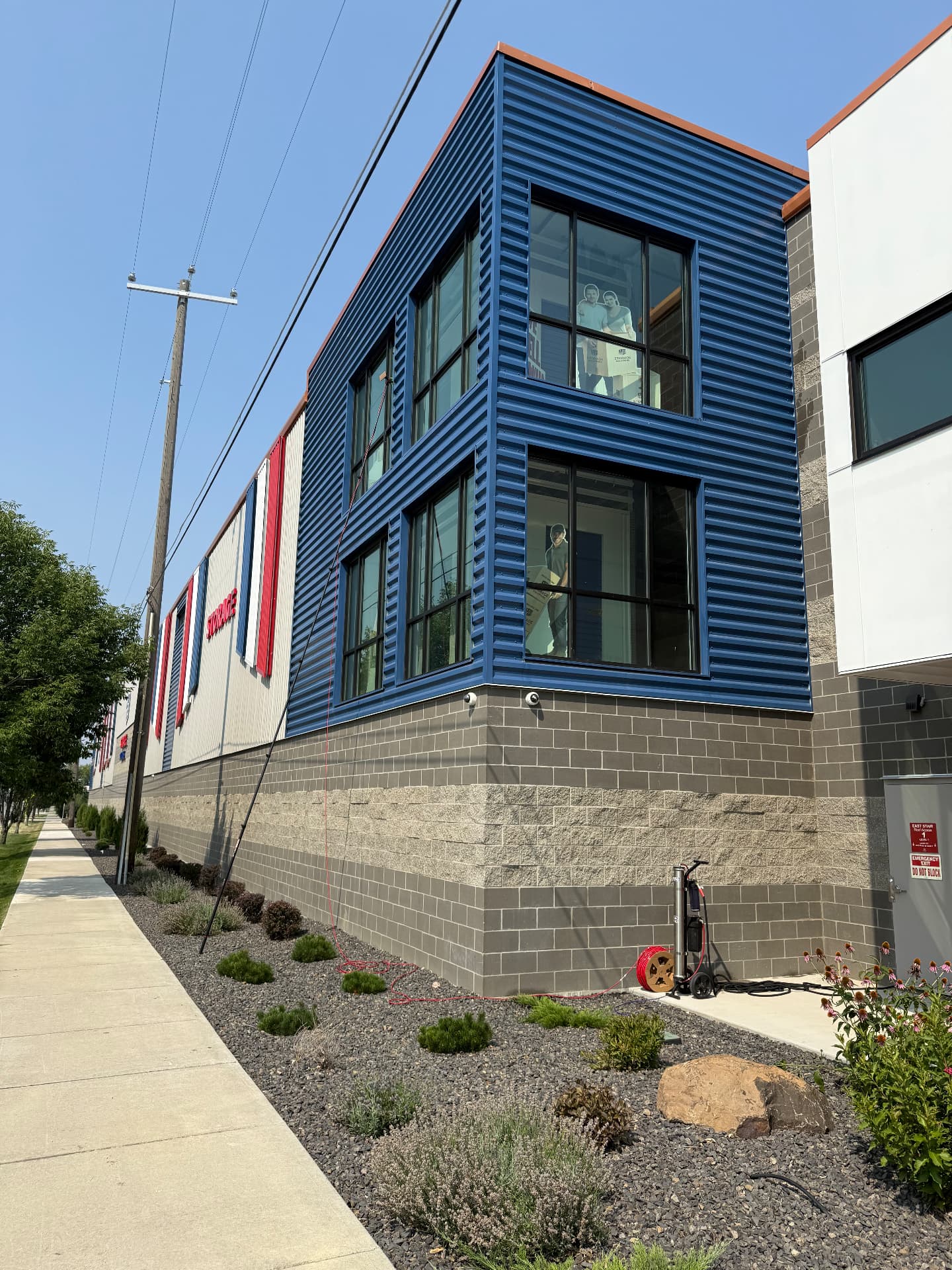 Commercial storage facility windows cleaned with a water-fed pole system